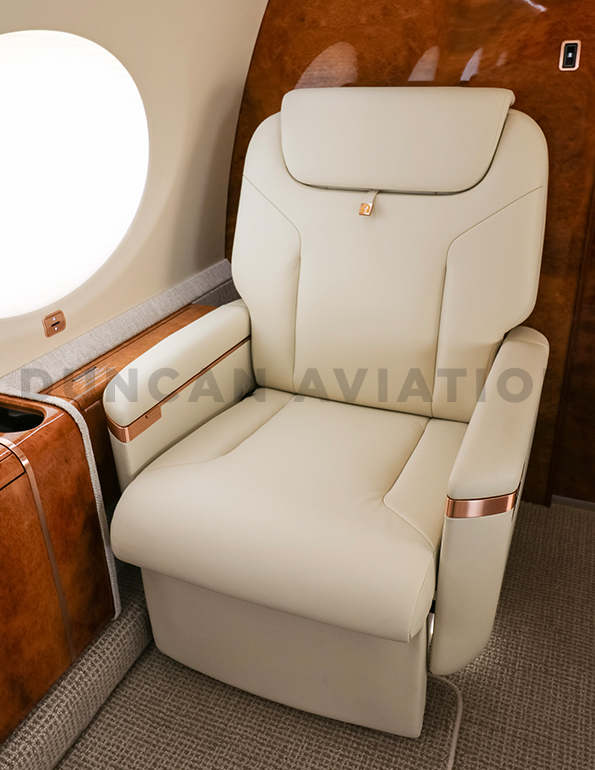 Cream leather captains chair in refurbished Gulfstream 650 by Duncan Aviation