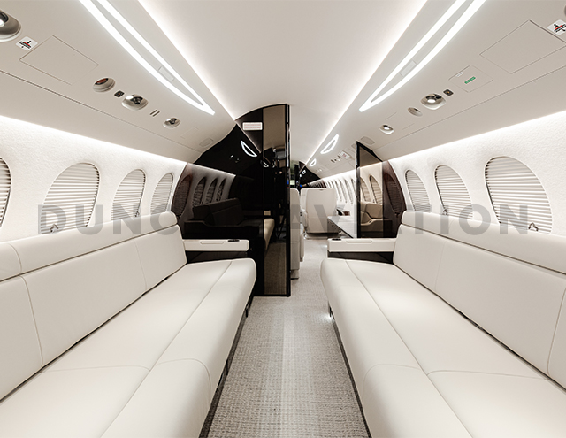 Two  cream leather divans with dark wood divider in refurbished Falcon 7X