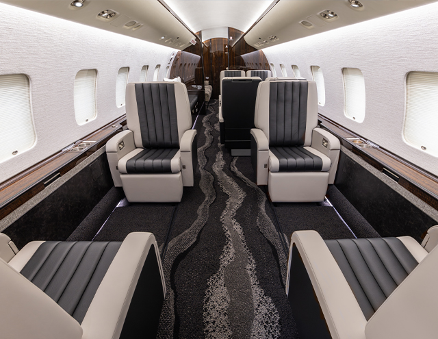 Interior of fully refurbished Global including carpet, chairs, and drinkrails