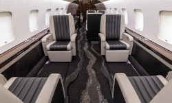 Interior of fully refurbished Global including carpet, chairs, and drinkrails