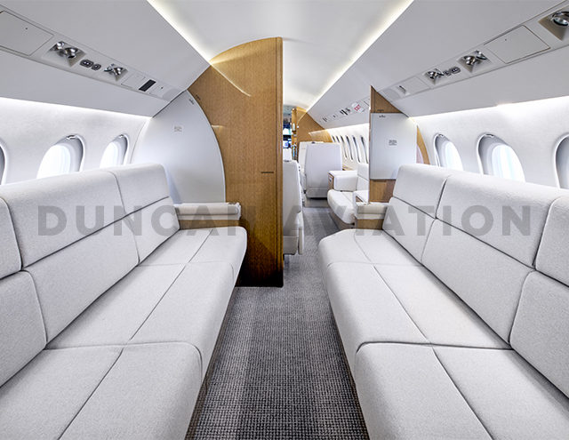 Matching divans inside refurbished interior of Falcon 900