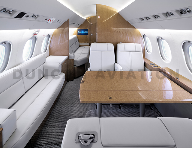 Refurbished interior of Falcon 900 with divan by Duncan Aviation